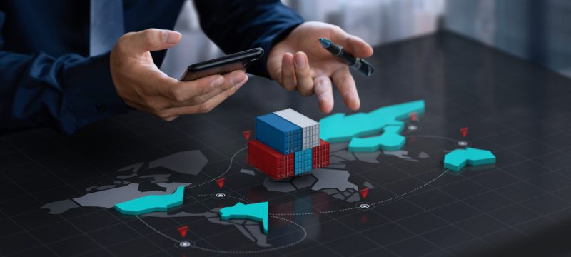 Professional Analyzing a Digital Transformation Map on a Global Scale, Representing Ailit's Certificate in Digital Transformation Leadership.